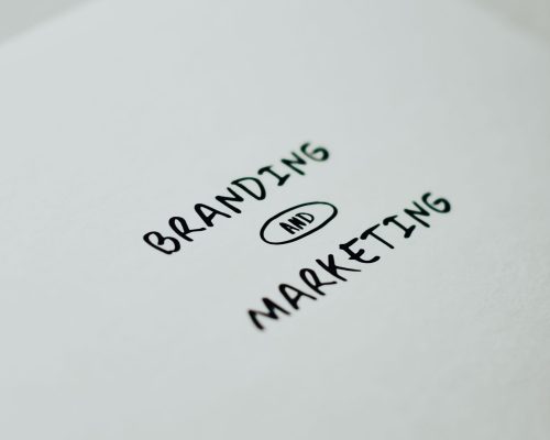 Minimalistic design showcasing 'branding and marketing' text for business strategy visuals.